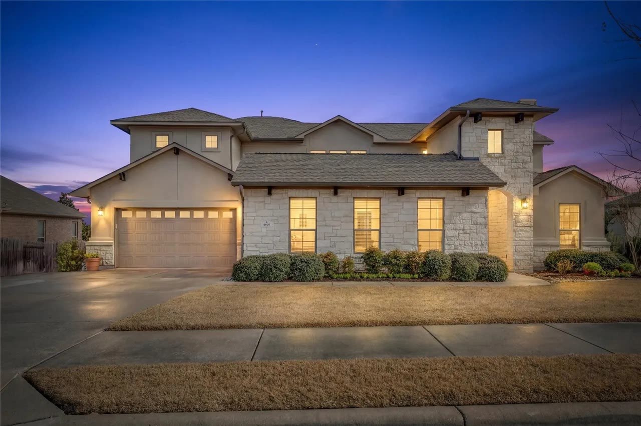 4518 Sansone Drive, Round Rock — two-story Texas Hill Country home at twilight